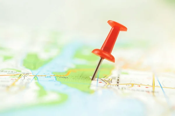 Selective focus of push pin on the map, red marker on navigation map concept photo