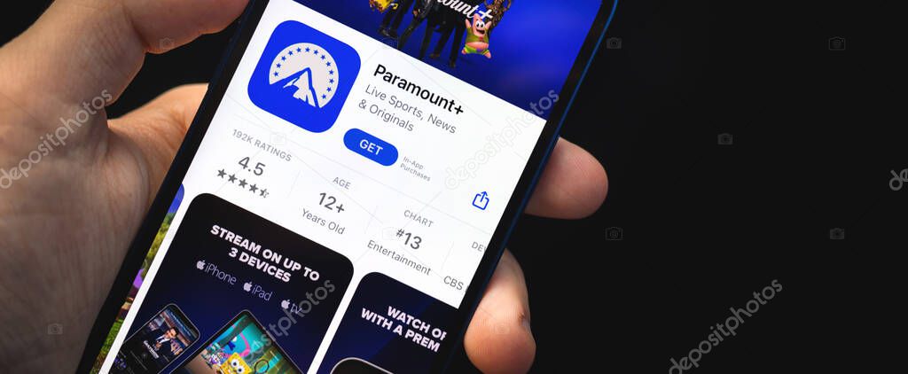 Kharkov, Ukraine - June 4, 2021: Paramount plus app, man hold mobile phone with application on the screen