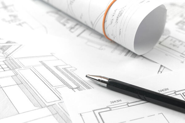 Architect design working background, drawing sketch plans blueprints and making architectural constructions concept photo