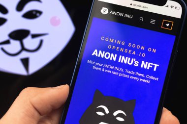 Anon Inu NFT ödenmez jetonu. Adam cep telefonunu anon inu web sitesiyle tut, kapat