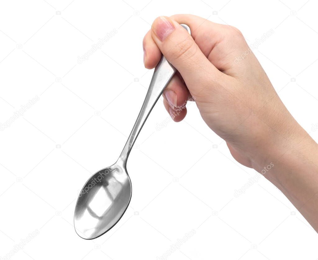 Hand holding kitchen spoon, isolated on a white background 