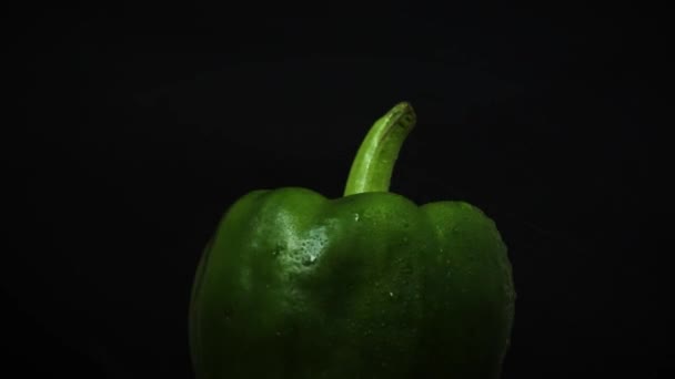 Green Sweet Pepper Droplets Black Background Rotating Video — Stock Video