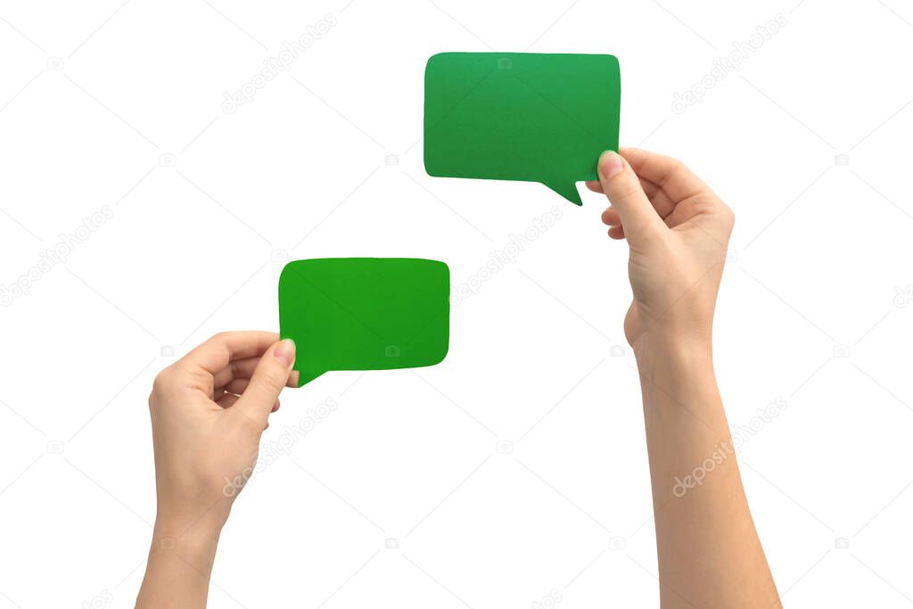 Set of green speech bubble in hands, isolated on a white background. Empty blank cardboard text message box photo
