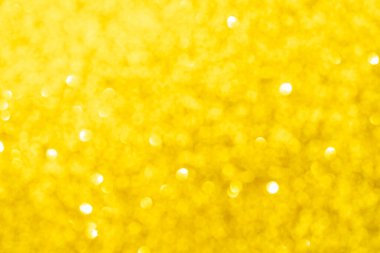 Soyut altın sarısı bulanık bokeh arkaplan. Parlak ışıklar. Bayram, Noel ve yeni yıl tasarımı için şenlik ve kutlama arkaplanı
