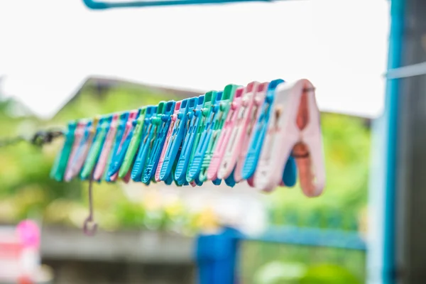 Clothes peg hang on a cord. — Stock Photo, Image