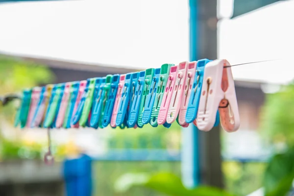 Clothes peg hang on a cord. — Stock Photo, Image