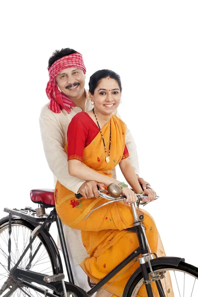 Couple riding a bicycle — Stock Photo, Image