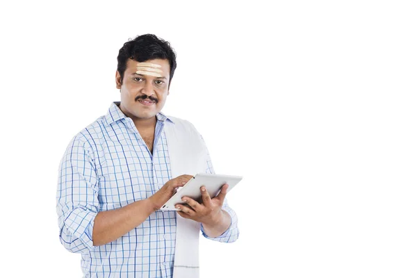 South Indian man using a digital tablet — Stock Photo, Image