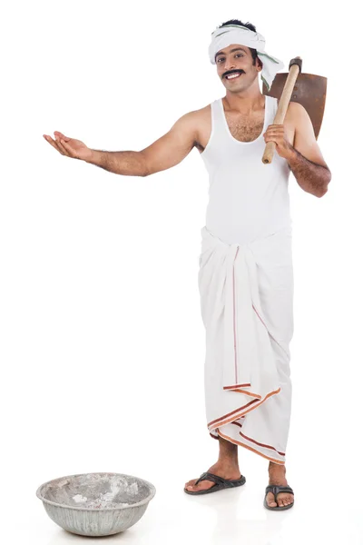 Portrait of a farmer carrying spade o his shoulders and gesturin — Stock Photo, Image