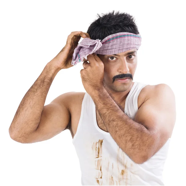 Portrait of a farmer tying cloth on his head — Stock Photo, Image