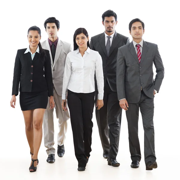 Portrait of five business executives walking — Stock Photo, Image