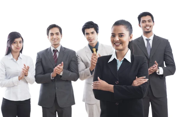 Portrait of business executives smiling and applauding — Stock Photo, Image