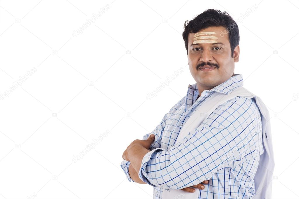 Portrait of a South Indian man  with his arms crossed