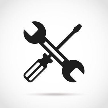 Crossed black and white wrench and screwdriver logo design elements