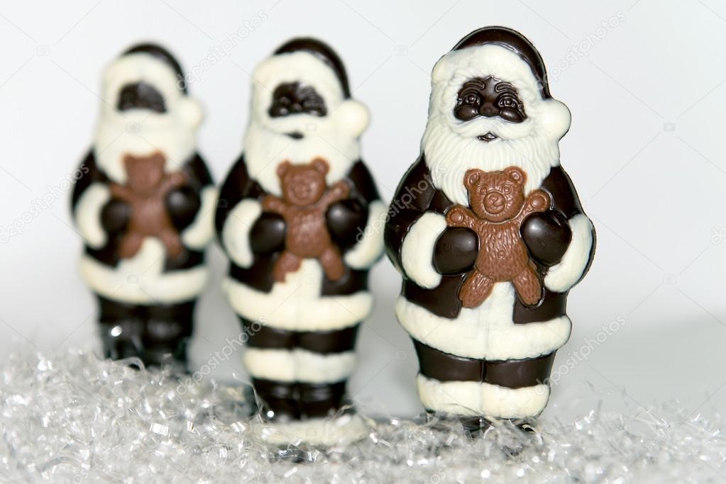 Trio of Chocolate Santas on Snow