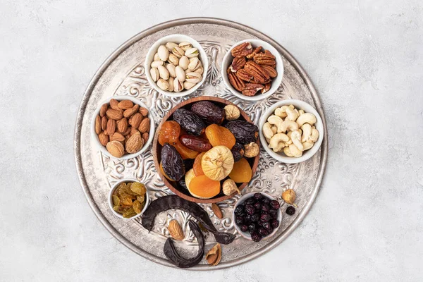 Mix from dried fruits and nuts in a bowl. Healthy food. Symbols of judaic holiday Tu Bishvat