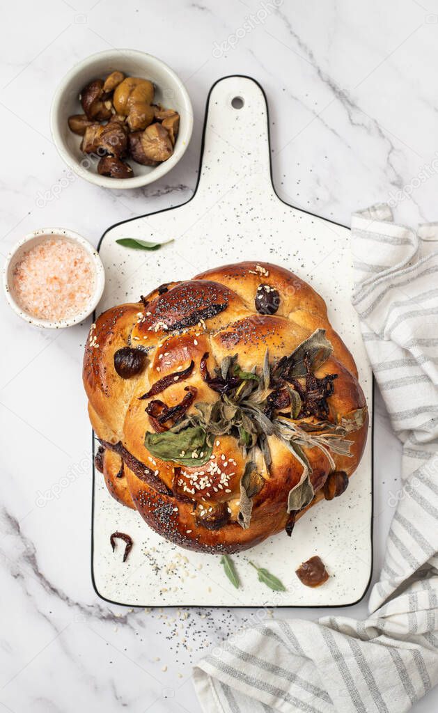 Homemade challah bread with chestnuts, onions and herbs