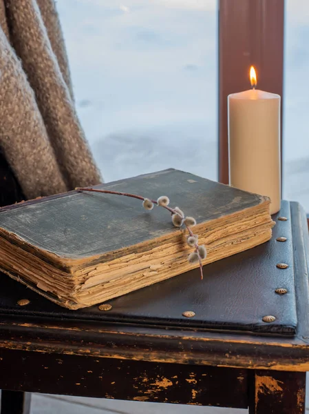 Old bible on a chair and a pussy willow branch — Stock Photo, Image