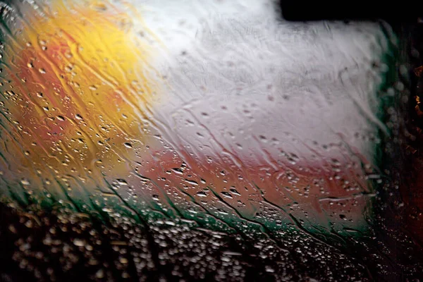 rain and water on the car window at night