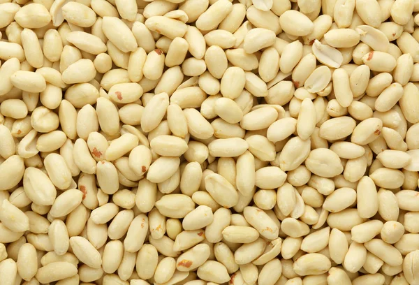 Очищенные семена арахиса для фона — стоковое фото