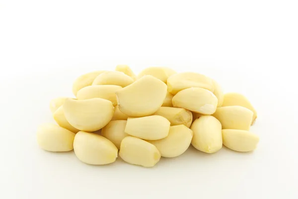 Peeled garlic on white background — Stock Photo, Image