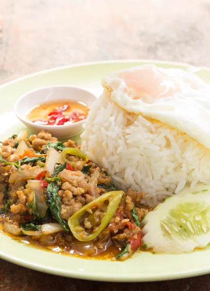 Rice topped with stir fried pork and holy basil — Stock Photo, Image