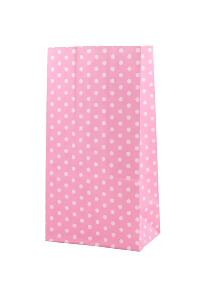 Розовый горошек бумажный пакет, изолированный на белом — стоковое фото