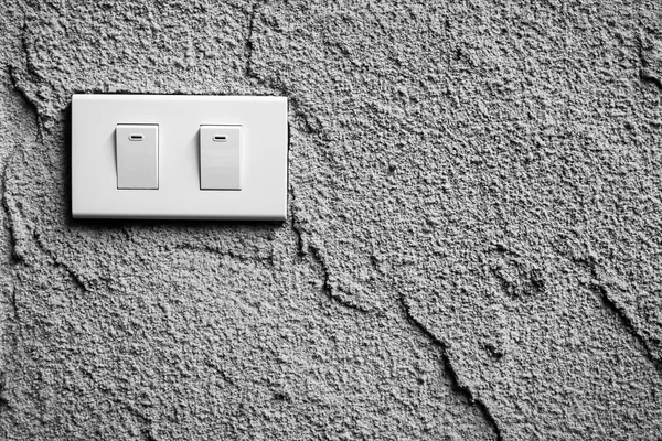 Blanco y negro de interruptor de luz en la pared — Foto de Stock