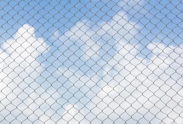 Chain link fence on sky background — Stock Photo, Image