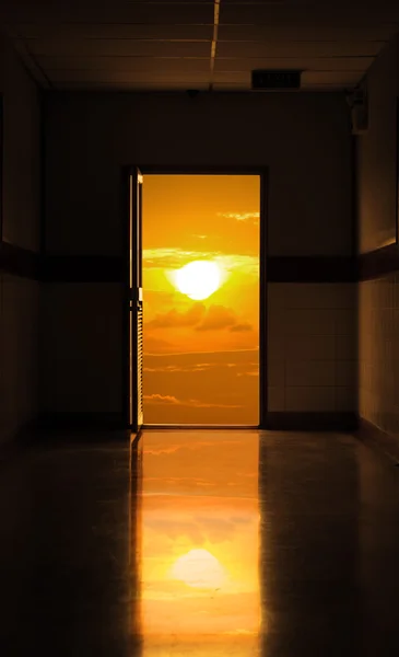 Open door with sunrise — Stock Photo, Image