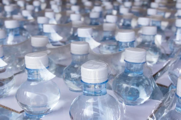 Wasserflaschen in Plastikfolie — Stockfoto © amstockphoto #54017647