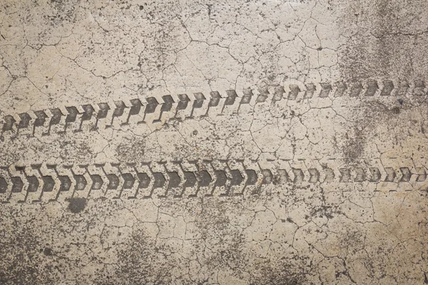 Bicycle tire track on cement floor — Stock Photo, Image