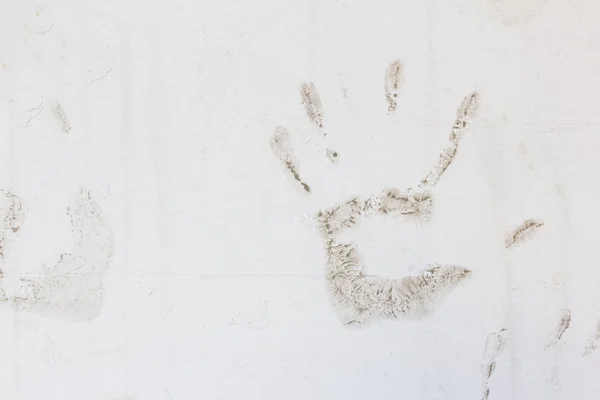 hands prints on gray wall background