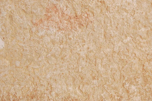 İnce desenli ve pürüzlü yüzey detaylarıyla doğal bej rengi taş dokusu. Tasarım, mimari, iç kavramlar için uygun nötr organik arkaplan ve kopya alanı ile en az arkaplan