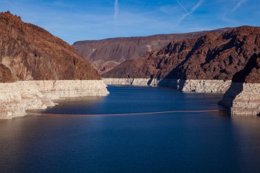 A drought in the west, the reservoir created by the Hoover Dam, sunk to its lowest level ever raising concerns about reduced output from the dams hydroelectric plan. clipart