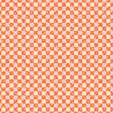 Sıcak renkli bir gingham wiith puantiyesi.