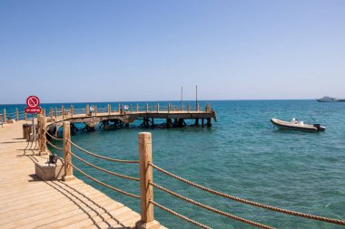 Perspective view of wooden pier at sea in Hurghada, Egypt.