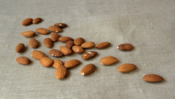 Almonds Scattered Linen Tablecloth — Stock Photo, Image