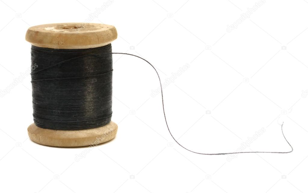 wooden spool of black thread