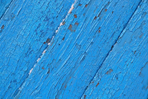 Superficie di legno incrinato sfondo blu — Foto Stock