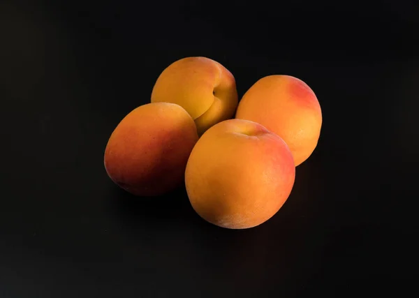 Four Ripe Fruits Apricot Black Background Isolated — Photo