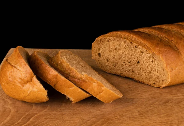 Pane Rubicondo Fette Pane Tagliato Esso Una Tavola Legno Uno — Foto Stock