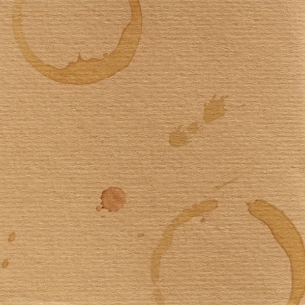 Texture de carton grunge et blobs de café — Image vectorielle