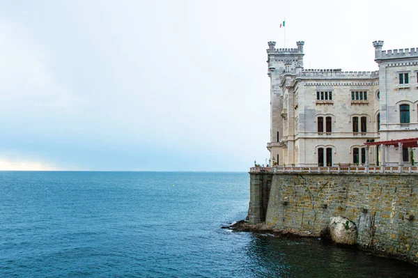 Miramare castle on the sea horizon close up. Italy