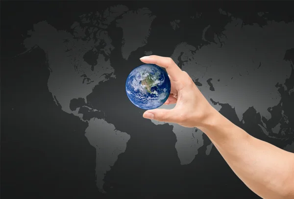 Man hand catching the earth on world map,Elements of this image furnished by NASA — Stock Photo, Image