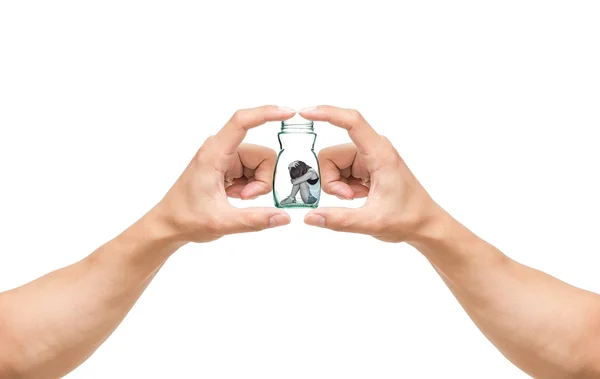 Man hands catching the Sad woman sitting alone in a jar on white background — Stock Photo, Image