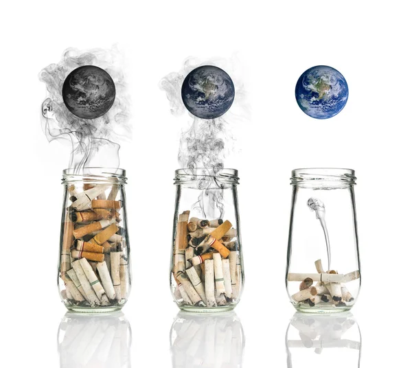 Cigarette butt in bottle with smoke Burning the world, world no tobacco day, Elements of this image furnished by NASA — Stock Photo, Image