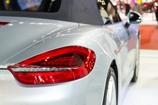 Detail on the rear light of a gray car in hall room — Stock Photo, Image