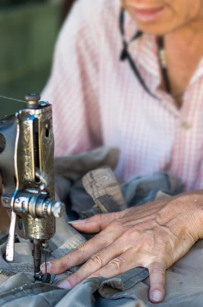 Mature Male Dressmaker Stitching Cloth On Sewing Machine High-Res Stock  Photo - Getty Images