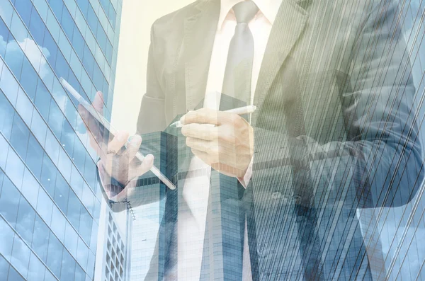 Businessman with cityscape background — Stock Photo, Image